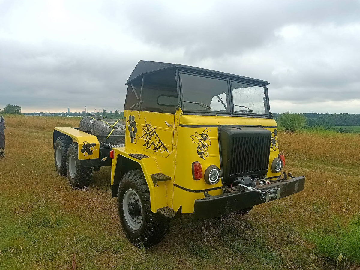 Star 6x6 Pszczolka after a PANCERX ARMOR rebuild: yellow cab with a black bee, black frame, winch